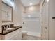 Clean, bright bathroom featuring a shower and vanity with granite countertop at 120 Triston Ct., Little River, SC 29566