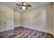 Empty bedroom featuring stylish floors, a ceiling fan, and a closet at 120 Triston Ct., Little River, SC 29566