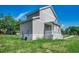 Charming home featuring vertical siding, white trim, covered porch, and well-maintained landscaping at 120 Triston Ct., Little River, SC 29566