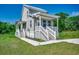 Exterior view of home with a porch and landscaping at 120 Triston Ct., Little River, SC 29566