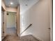 Upstairs hallway with carpet and door to bedroom at 120 Triston Ct., Little River, SC 29566