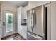 Stainless steel refrigerator in a bright kitchen with white cabinets and dark countertops at 120 Triston Ct., Little River, SC 29566
