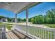 Covered porch and scenic green yard at 120 Triston Ct., Little River, SC 29566