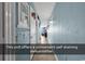 Hallway to ocean view balcony with dehumidifier at 1210 N Waccamaw Dr. # 1008, Garden City Beach, SC 29576