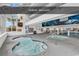 Bright indoor jacuzzi with a tropical mural and natural light at 1210 N Waccamaw Dr. # 1008, Garden City Beach, SC 29576