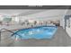 Large indoor pool with murals and tables at 1210 N Waccamaw Dr. # 1008, Garden City Beach, SC 29576
