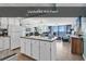 Updated kitchen with a view of the ocean at 1210 N Waccamaw Dr. # 1008, Garden City Beach, SC 29576