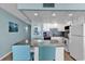 Bright kitchen with white cabinetry, granite countertops, and stainless steel appliances at 1210 N Waccamaw Dr. # 1008, Garden City Beach, SC 29576