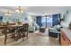 Open-concept living room offering ocean views and comfortable seating at 1210 N Waccamaw Dr. # 1008, Garden City Beach, SC 29576