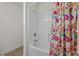 Bright bathroom with shower-tub combination and a colorful, floral-themed shower curtain at 1249 Shoebridge Dr. # 1249, Myrtle Beach, SC 29579