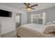 Bright bedroom with a ceiling fan, large window, and comfortable bedding, creating a relaxing atmosphere at 1249 Shoebridge Dr. # 1249, Myrtle Beach, SC 29579