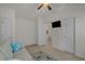 Well-lit bedroom features a comfortable sofa with a view to the home's upstairs at 1249 Shoebridge Dr. # 1249, Myrtle Beach, SC 29579