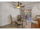 Cozy dining area with glass table, decorative chairs, and sliding glass doors to a screened porch at 1249 Shoebridge Dr. # 1249, Myrtle Beach, SC 29579