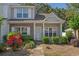 Townhome exterior with brick details, neatly trimmed shrubs, and a clear pathway to the front door at 1249 Shoebridge Dr. # 1249, Myrtle Beach, SC 29579