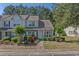 Inviting townhome with lush landscaping, flowering bushes, and a well-manicured front yard at 1249 Shoebridge Dr. # 1249, Myrtle Beach, SC 29579
