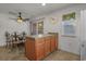 View of kitchen area with island, decorative clock, and nearby dining table at 1249 Shoebridge Dr. # 1249, Myrtle Beach, SC 29579