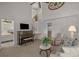 Open living room featuring a piano, high ceilings, and an elegant staircase leading to the upper level at 1249 Shoebridge Dr. # 1249, Myrtle Beach, SC 29579
