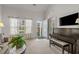 Bright living room with vaulted ceiling, large windows, and a glimpse of the outdoor landscape at 1249 Shoebridge Dr. # 1249, Myrtle Beach, SC 29579