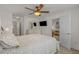 Comfortable bedroom with ceiling fan, TV, and an en-suite bathroom offering a view into the cozy living area at 1249 Shoebridge Dr. # 1249, Myrtle Beach, SC 29579
