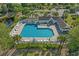Aerial shot of a sparkling community pool with ample lounge chairs and palm trees at 1249 Shoebridge Dr. # 1249, Myrtle Beach, SC 29579