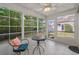 Well-lit sunroom with a cozy seating area and views of the lush backyard at 1249 Shoebridge Dr. # 1249, Myrtle Beach, SC 29579