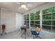 Enclosed sunroom with tile flooring, plenty of windows and comfortable seating for relaxation at 1249 Shoebridge Dr. # 1249, Myrtle Beach, SC 29579