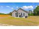 A cozy patio area features an outdoor dining set perfect for enjoying meals and relaxing outside at 1396 Highway 129, Galivants Ferry, SC 29544