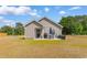 A relaxing patio area with a dining set and grill for outdoor cooking and entertaining friends and Gathering at 1396 Highway 129, Galivants Ferry, SC 29544