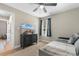 Bright bedroom featuring a ceiling fan, a TV and a comfortable gray daybed at 1396 Highway 129, Galivants Ferry, SC 29544