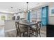 Inviting dining area featuring a modern chandelier, stylish table, and easy access to the kitchen at 1396 Highway 129, Galivants Ferry, SC 29544