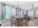 Bright dining area with wood table, seating for four and an open view to the living room at 1396 Highway 129, Galivants Ferry, SC 29544