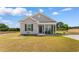 Charming single-story home with gray siding, black shutters, and a cozy front porch at 1396 Highway 129, Galivants Ferry, SC 29544