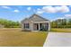 Inviting single-story home with gray siding, black shutters, and a concrete driveway at 1396 Highway 129, Galivants Ferry, SC 29544
