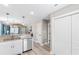 Kitchen and hallway view with stainless steel appliances and new flooring at 1396 Highway 129, Galivants Ferry, SC 29544