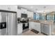 Modern kitchen with white cabinets, stainless steel appliances, and granite countertops at 1396 Highway 129, Galivants Ferry, SC 29544