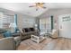 Comfortable living room with cozy seating, a ceiling fan, and plenty of natural light at 1396 Highway 129, Galivants Ferry, SC 29544