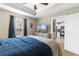 Bright and airy main bedroom featuring a television, ensuite bath, and access to the kitchen at 1396 Highway 129, Galivants Ferry, SC 29544