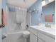Clean bathroom featuring a shower/tub combo with white shower curtain and white vanity at 1500 Cenith Dr. # D 103, North Myrtle Beach, SC 29582