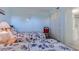 Cozy bedroom with nautical bedding, pale blue walls, closet and en-suite bathroom at 1500 Cenith Dr. # D 103, North Myrtle Beach, SC 29582