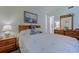 Inviting bedroom features a charming nautical theme, a white quilt and light blue walls at 1500 Cenith Dr. # D 103, North Myrtle Beach, SC 29582