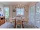Cozy dining area with a table for four, nautical decor, and lots of natural light at 1500 Cenith Dr. # D 103, North Myrtle Beach, SC 29582