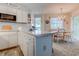 Bright kitchen featuring updated appliances and a view into the dining area at 1500 Cenith Dr. # D 103, North Myrtle Beach, SC 29582