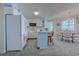 Bright kitchen with a breakfast bar that connects to the dining area with a table for four at 1500 Cenith Dr. # D 103, North Myrtle Beach, SC 29582