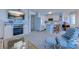 Coastal living room featuring an electric fireplace, television and a partial view of kitchen at 1500 Cenith Dr. # D 103, North Myrtle Beach, SC 29582