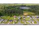 Aerial view of a home's placement in a quiet neighborhood, showcasing its well-maintained yard and community surroundings at 1505 Bramber Pl., Conway, SC 29527