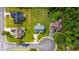 This aerial view showcases a suburban home's neatly mowed lawn and surrounding mature trees at 1505 Bramber Pl., Conway, SC 29527