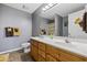 Double vanity in this bathroom, highlighted with wood cabinets and a large mirror, enhancing its functional appeal at 1505 Bramber Pl., Conway, SC 29527
