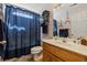 Bathroom featuring a vanity, toilet, and shower with a navy curtain at 1505 Bramber Pl., Conway, SC 29527