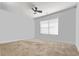 This bedroom features neutral walls, carpet, a window, and a ceiling fan at 1505 Bramber Pl., Conway, SC 29527