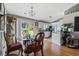Bright dining area adjacent to the kitchen, featuring a glass-top table and sliding glass doors to the backyard at 1505 Bramber Pl., Conway, SC 29527